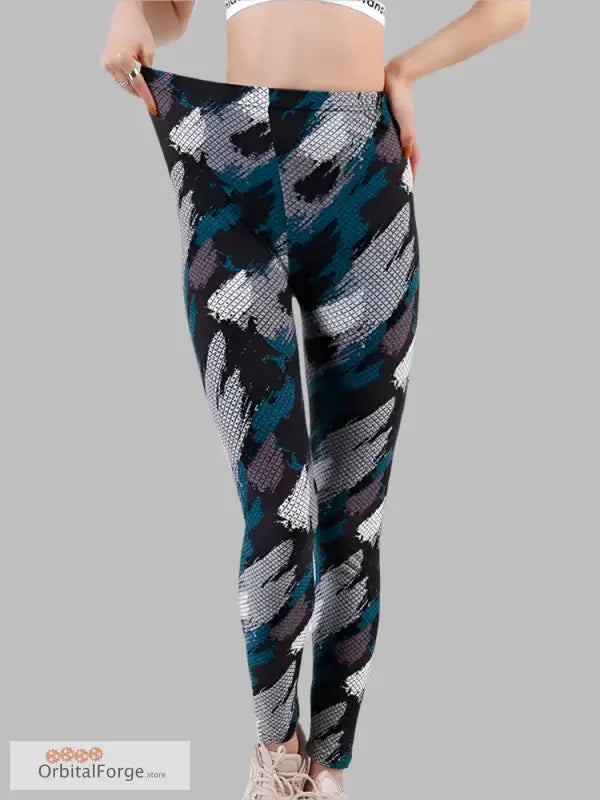 Athletic slim stretch camouflage leggings in abstract black, teal, and gray for casual wear