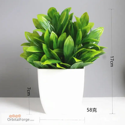 Artificial green plant with glossy leaves in a white ceramic pot.