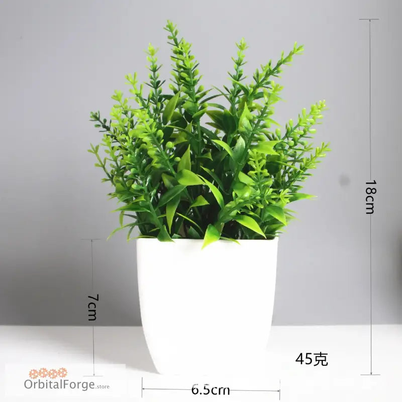 Green artificial plant in a white ceramic pot.