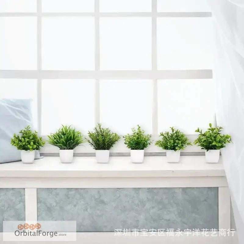 Six potted artificial green plants arranged in a row in white containers.