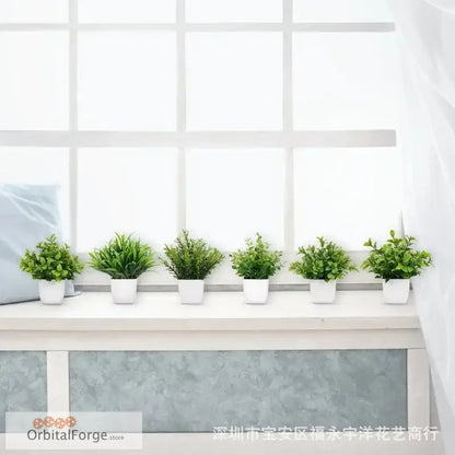 Six potted artificial green plants arranged in a row in white containers.