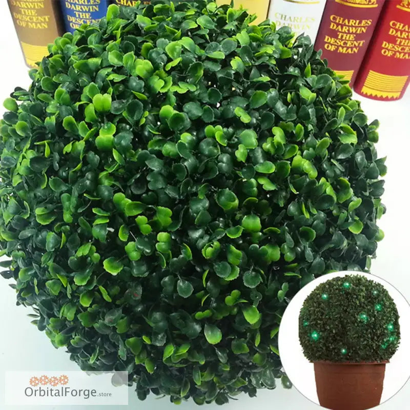 Spherical artificial topiary bush with dense green leaves.