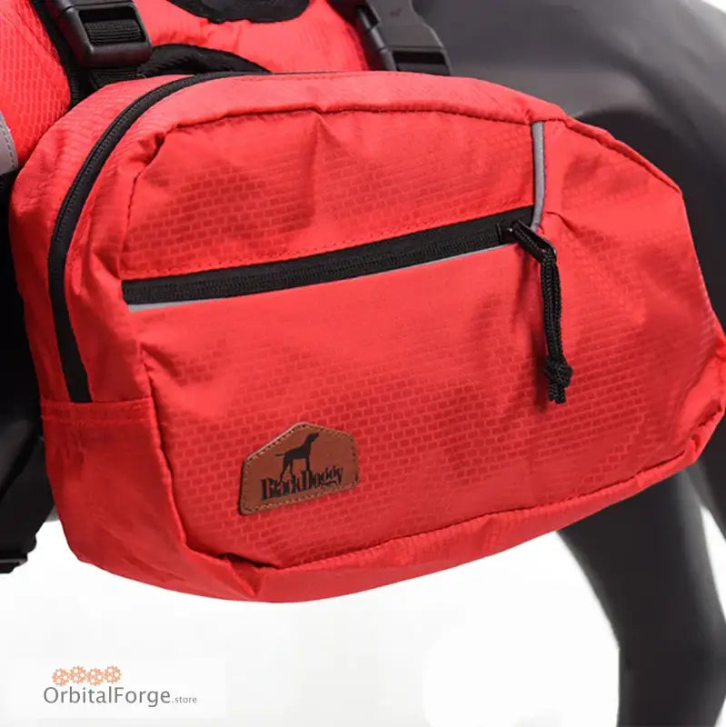 Red dog backpack with black straps and zipper pockets.