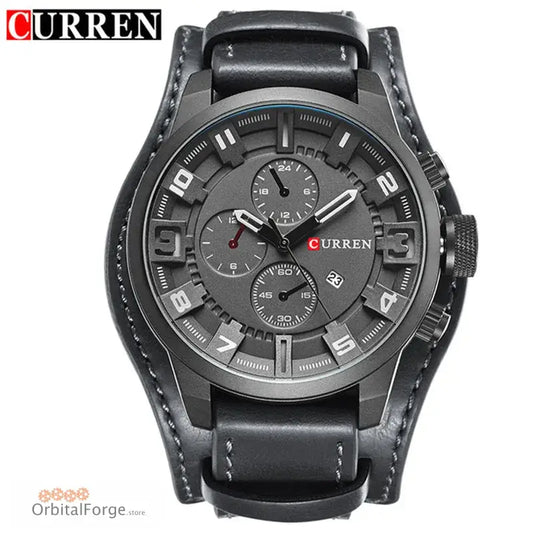 Black leather and gunmetal chronograph watch with a wide cuff-style band.