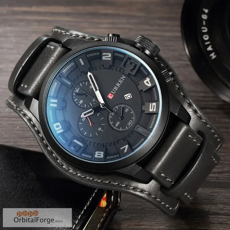 Black leather chronograph watch with a dark blue dial and silver numerals.