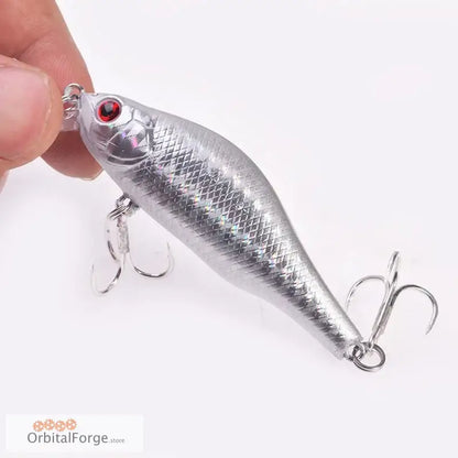 Silver fishing lure with red eyes and treble hooks, durable hard plastic for predatory fish