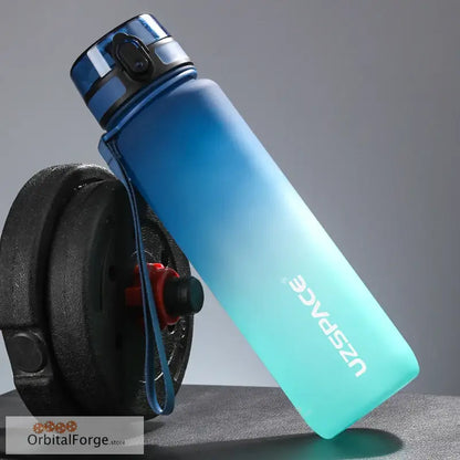 Gradient blue-to-turquoise reusable water bottle with a silver cap.