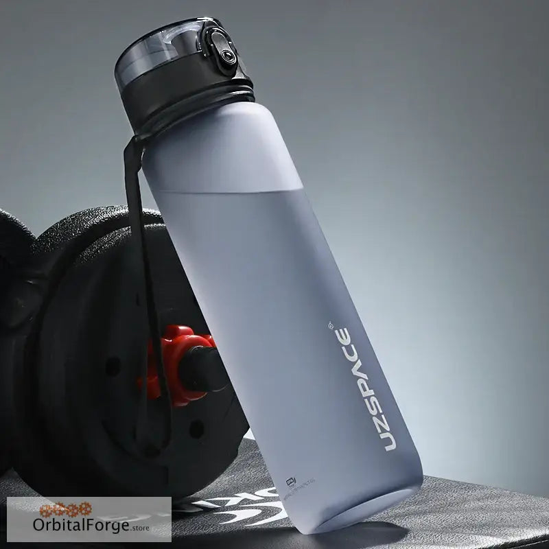 Matte grey reusable water bottle with a black cap.