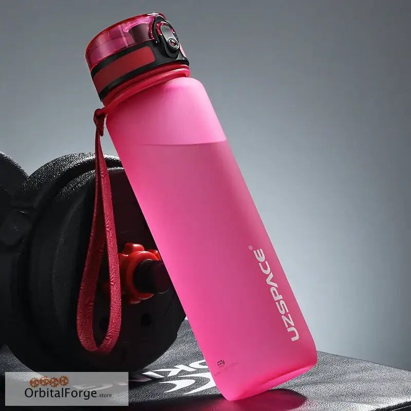 Pink reusable water bottle with a carrying strap.