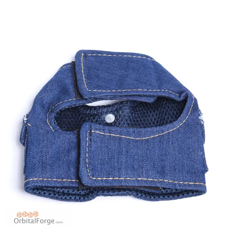 Denim dog harness with mesh lining and stitched details.