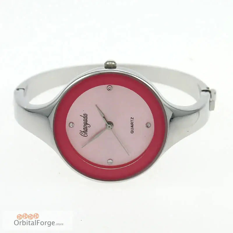 Elegant Stainless Steel Women’s Cuff Watch featuring a pink dial and red bezel