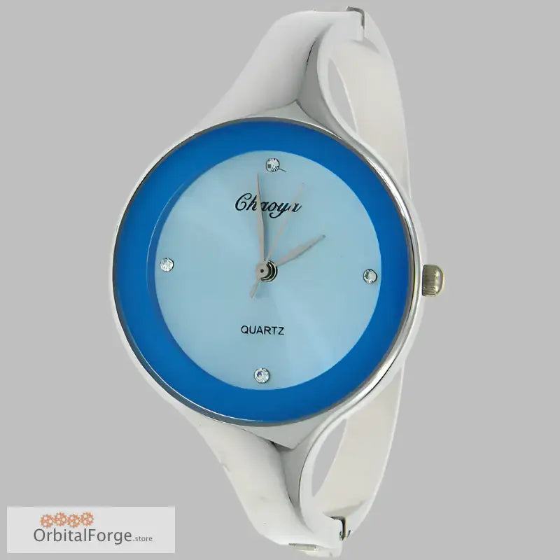 White bangle cuff watch with blue face and stainless steel accents for women