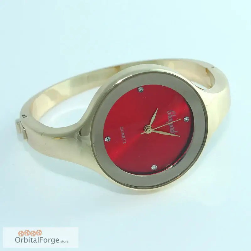 Gold-toned cuff watch with red dial and stainless steel bracelet for women