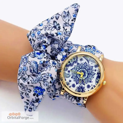 Floral fabric bracelet watch in blue and white with a gold-tone case design