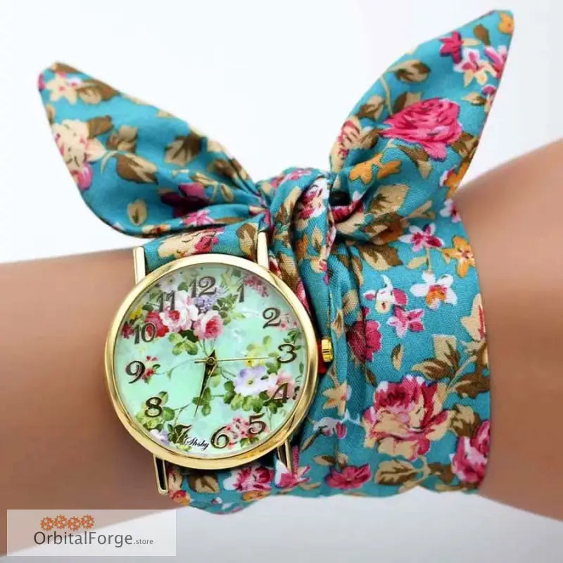 Floral fabric bracelet watch with bow-style band in turquoise and pink rose print