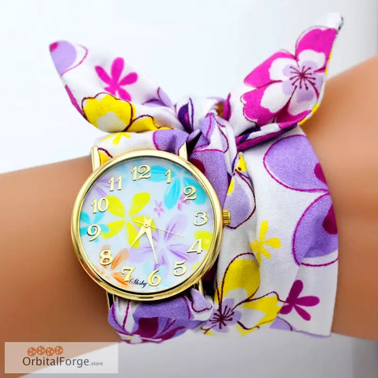 Floral fabric bracelet watch featuring a colorful flower-patterned face and band