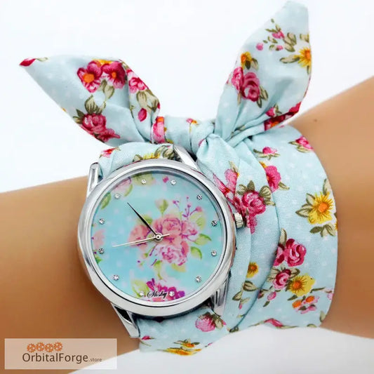 Floral fabric bracelet watch featuring pink roses and yellow daffodils on blue background