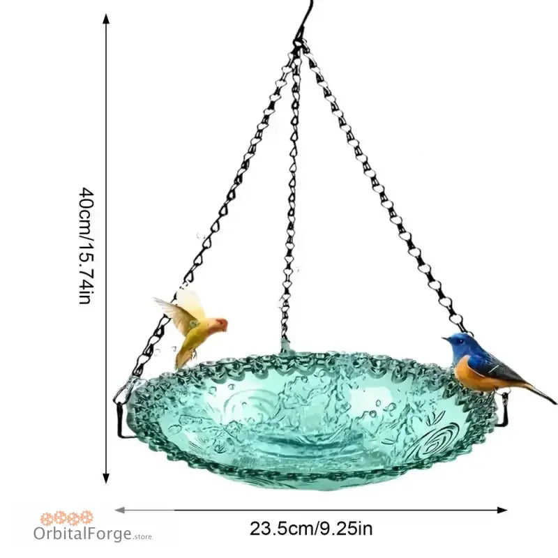 A hanging glass bird bath with decorative birds perched on its rim.