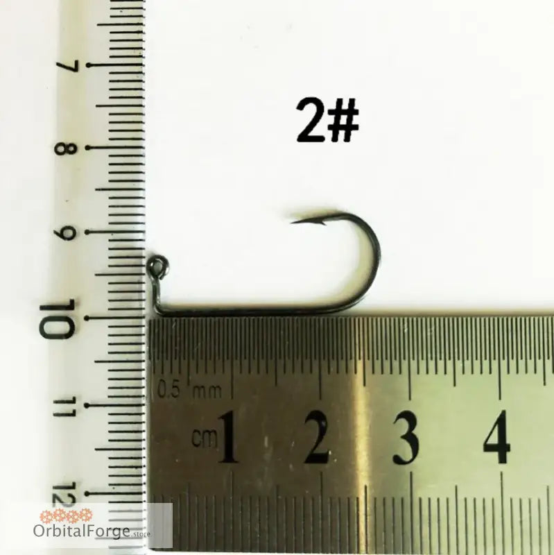 Curved 2# Aberdeen Fishing Hook made of high carbon steel next to a measuring ruler