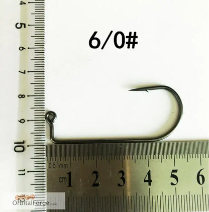 Curved 6/0 High Carbon Steel Aberdeen Fishing Hook next to a measuring ruler