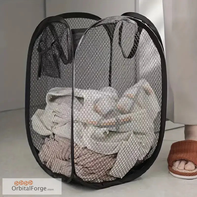 Mesh laundry hamper filled with clothes.