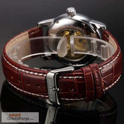 Luxury Skeleton Watch featuring a 40mm polished case, brown leather strap, and silver tone