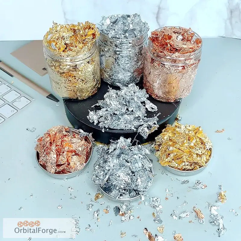 Metallic foil flakes in jars and bowls.