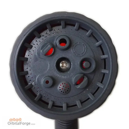 Dark gray circular sprinkler head with multiple water outlet holes.