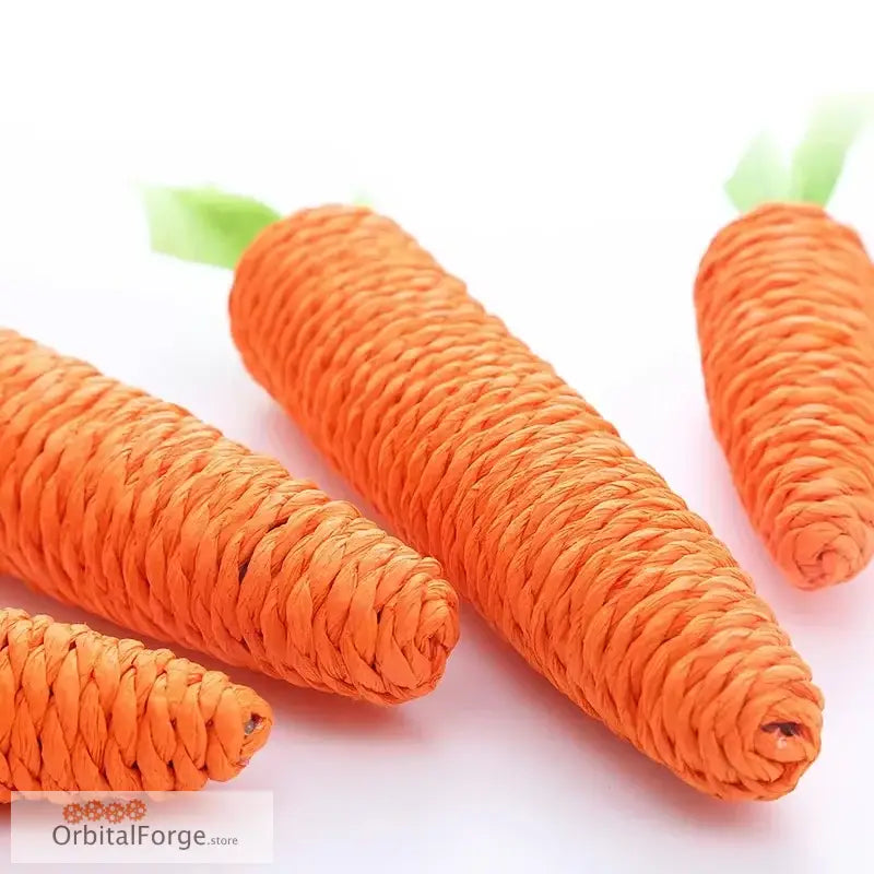 Woven orange carrots with green tops.