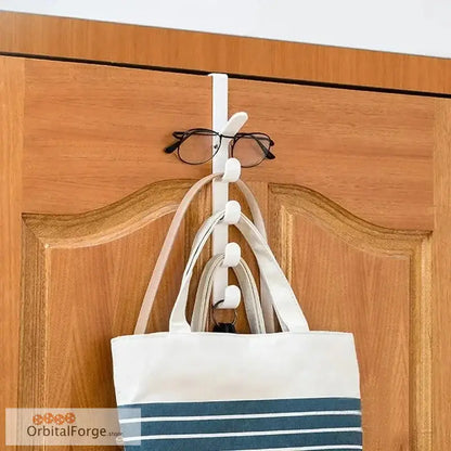 Over-the-door hook rack with hanging items.