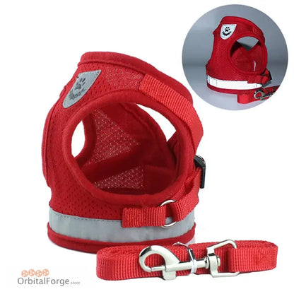 Red mesh dog harness with reflective strips and attached leash.