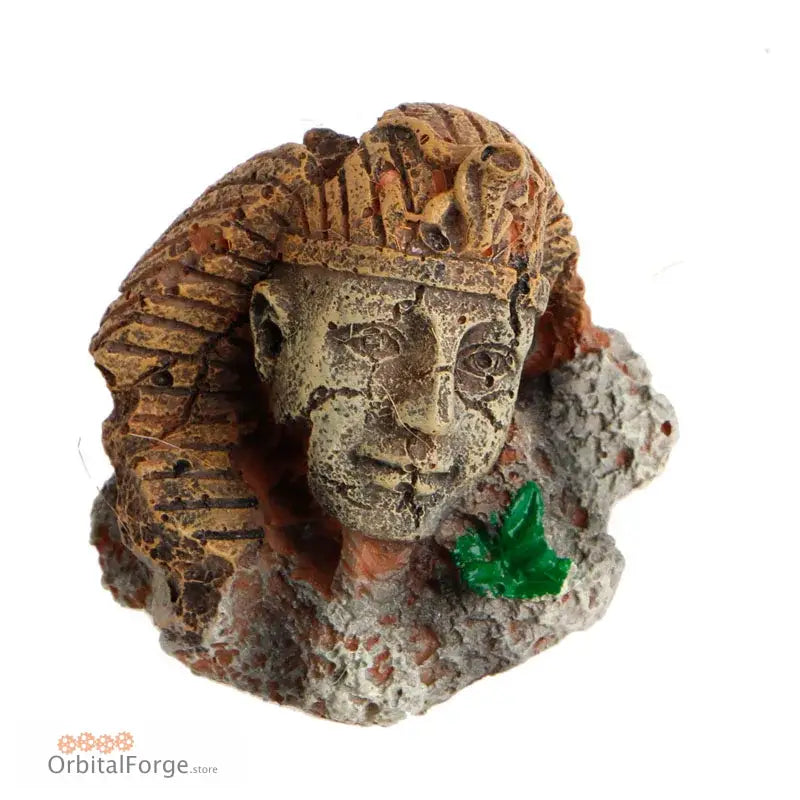 Ancient Egyptian-style carved stone head with a headdress and an emerald green crystal formation attached.