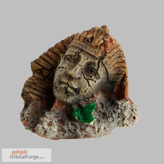 Ancient stone sculpture fragment with emerald crystal, perfect for aquarium ornament