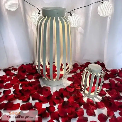 White striped lantern with a mint green top surrounded by red rose petals.