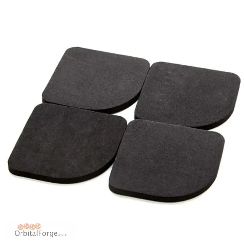 Four black square foam or rubber pads arranged in a grid pattern.