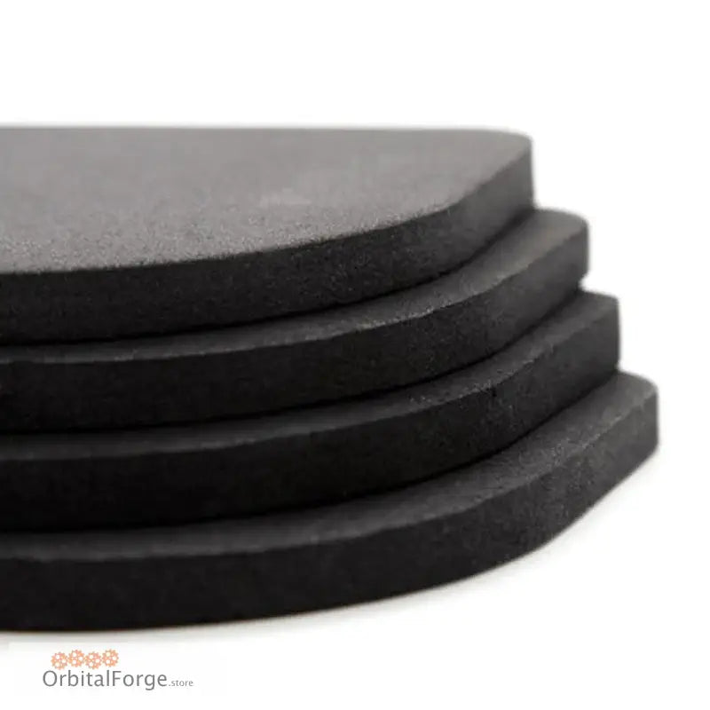 Stack of black rubber or foam coasters.