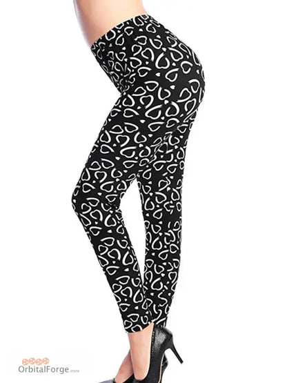 Black heart-pattern camouflage leggings with high heels for stylish casual wear