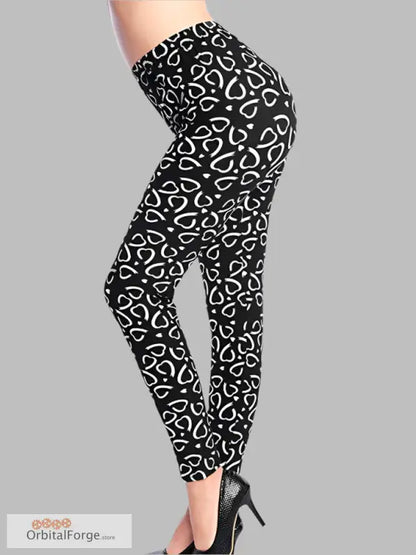 Black leggings with white heart pattern and high heels for stylish casual wear