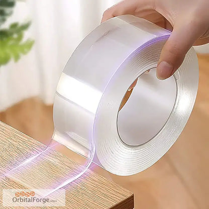 Roll of clear, double-sided adhesive tape.