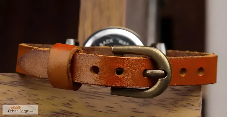 Brown leather belt with metal buckle paired with Vintage Roman Numeral Wristwatch