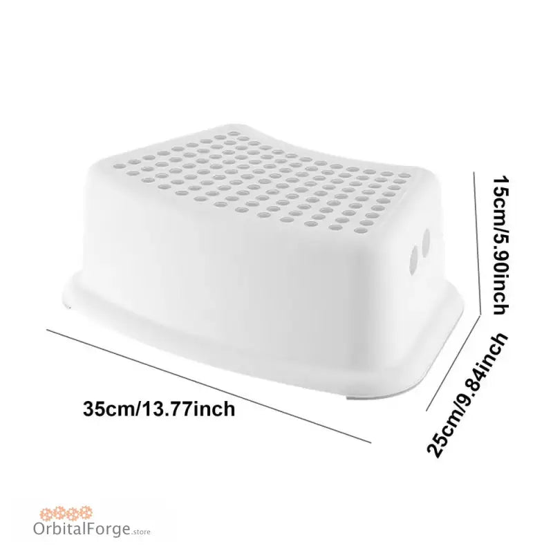 White plastic step stool with textured dots on top surface.