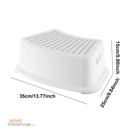 White plastic step stool with textured dots on top surface.