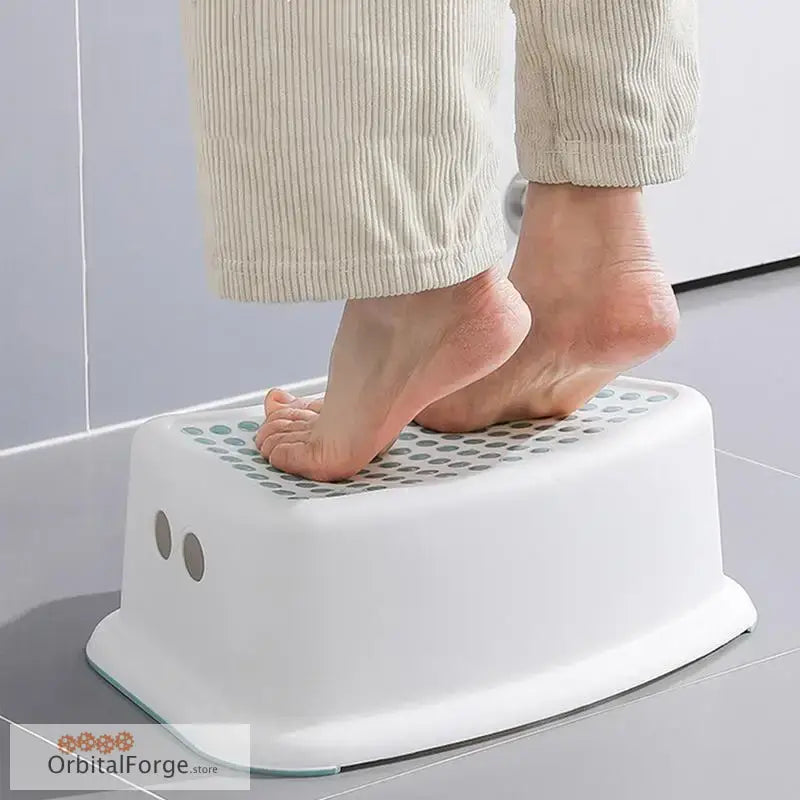 White plastic step stool with textured non-slip surface.