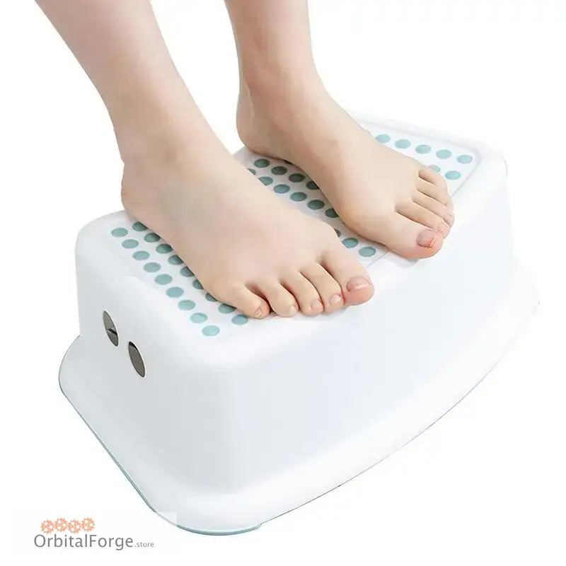 White non-slip bathroom step stool with textured dots on the surface.