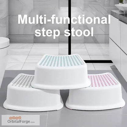 White plastic step stool with textured non-slip surfaces in different colors.