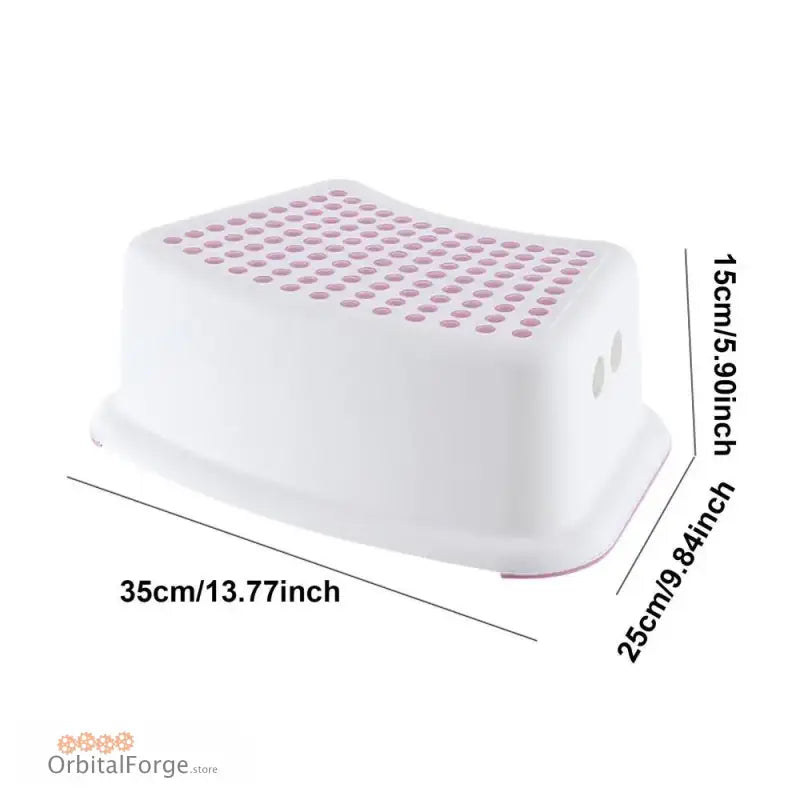 White plastic step stool with pink non-slip dots on top.